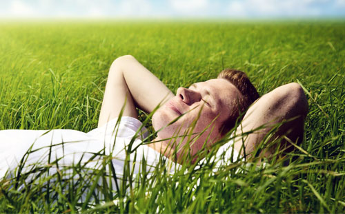person laying in grass
